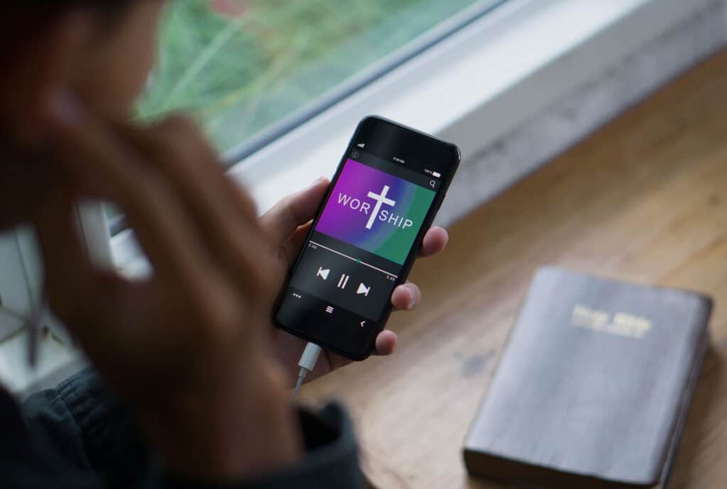 Phone with playing worship music from online stream