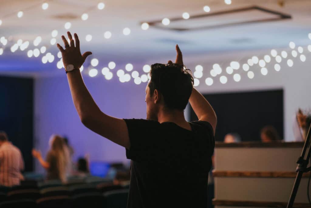 Man raising hands in praise and worship