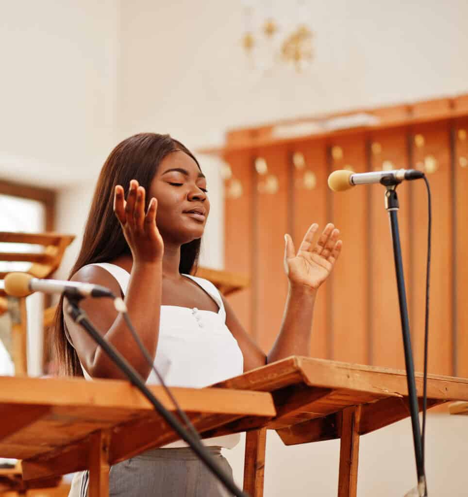 Ethnic women leading worship live event